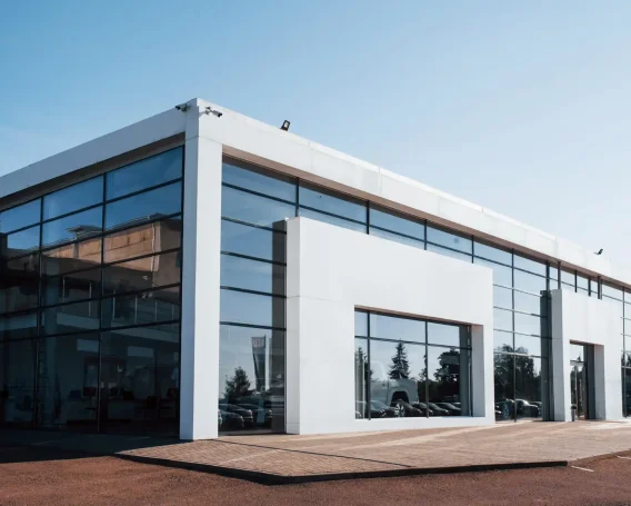 modern-car-building-many-vehicles-inside-sunny-d-2023-11-27-04-58-06-utc-scaled